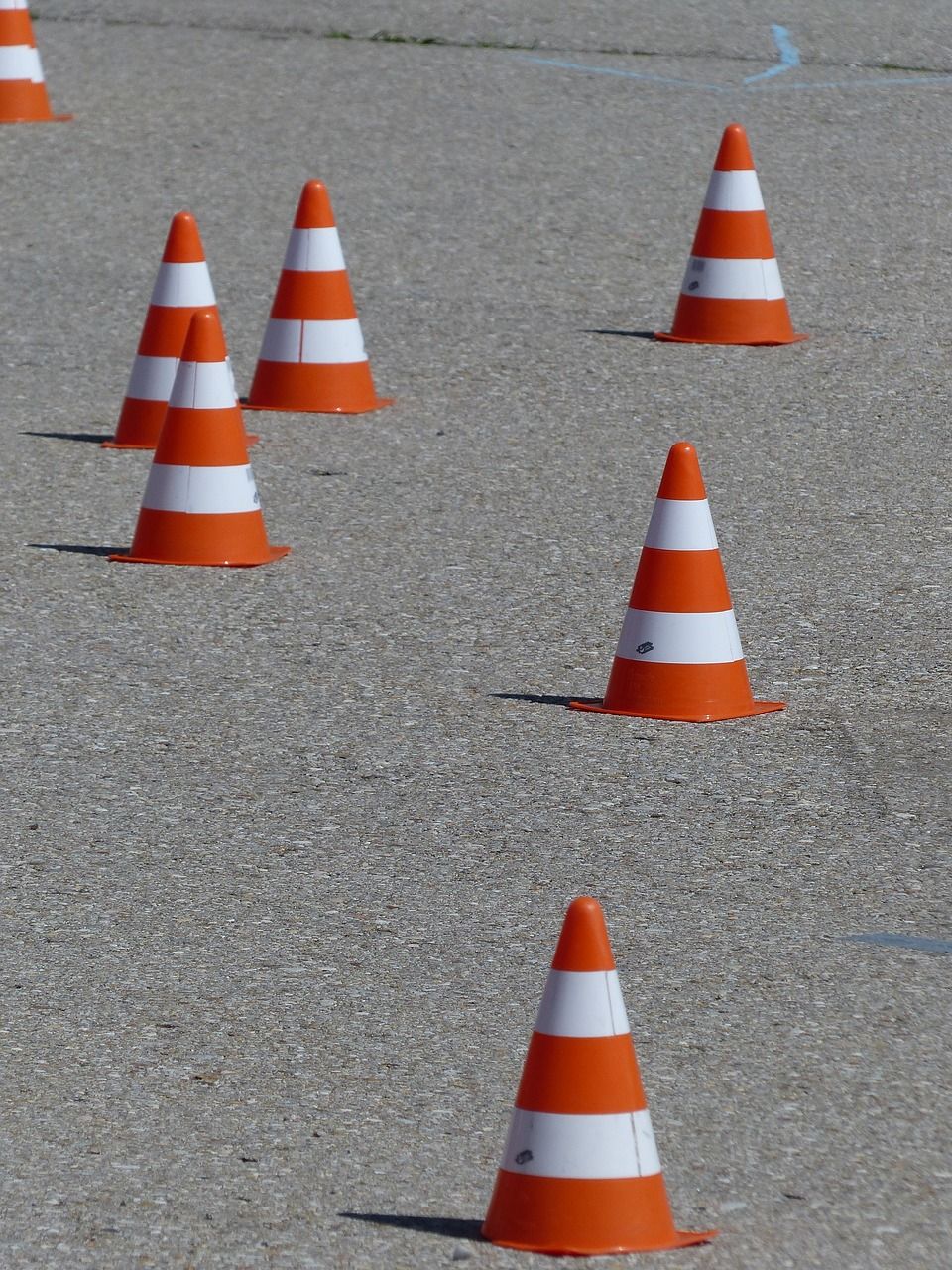 Traffic cones laid out on the ground for a zig zag bike course Traffic cones laid out on the ground for a zig zag bike course
